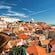 A couple of children admiring the view of the Alfama neighborhood in Lisbon, Portugal